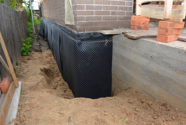 SJ Waterproofing Pros technician performing targeted Waterproofing assessment in Columbiana, OH